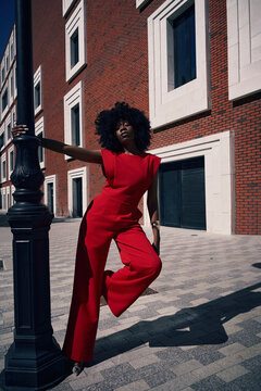 Fashion portrait of woman posing in modern city street