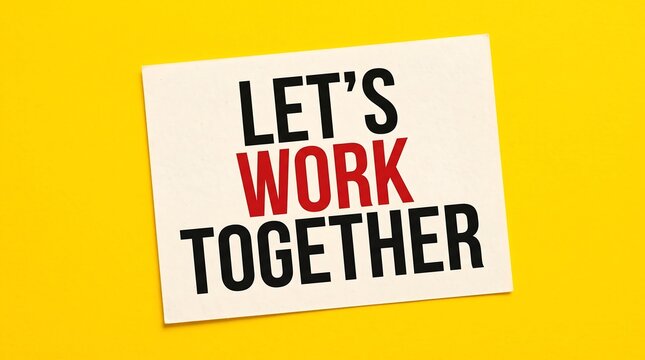 Let's Work Together motivational text on white card. Collaboration and teamwork concept on yellow background. Business partnership message.