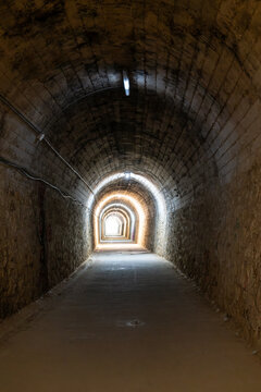 Originally built as a narrow-guage railway tunnel in 1947 the 650m tunnel beneath the village of Arnedillo is part of the Via Verde de Cidacos and connects the nearby thermal pools to the village