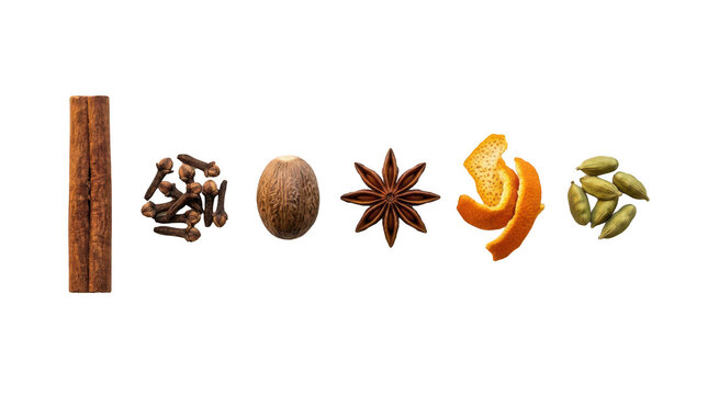 Cinnamon stick cloves nutmeg star anise orange peel and cardamom pods arranged in a row for cooking and baking