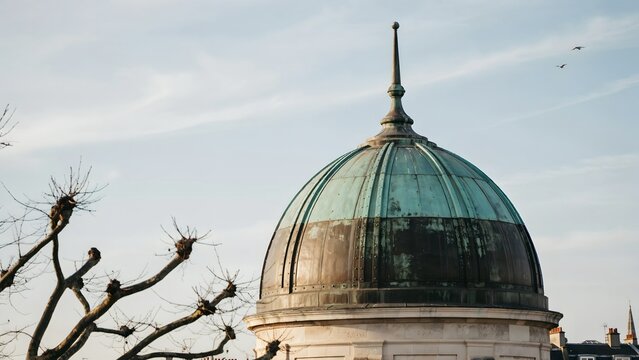 Historic Observatorio Dome with Classic Architecture and Tall Spire Sky View