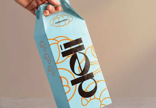 Hand Holding Deli Bakery Box Mockup