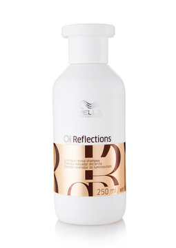 LONDON, UK - MARCH 22, 2026: Plastic bottle container of Wella Oil reflections luminous reveal shampoo on white background.