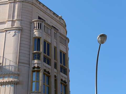 Modernist Building Corner with Curved Bay Windows and Street Lamp