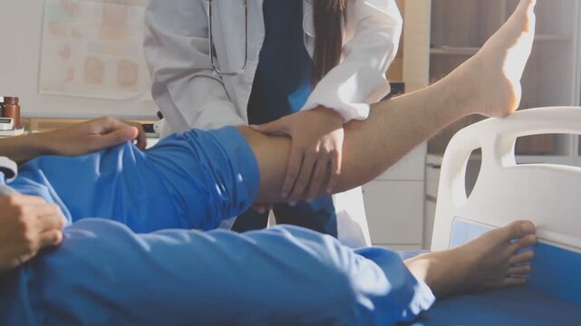 Physical therapist performing ankle examination on patient in clinic