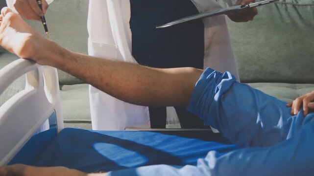 Physical therapist performing ankle examination on patient in clinic
