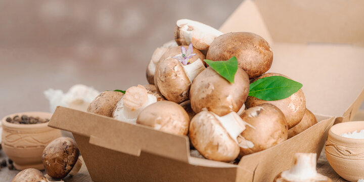 Fresh raw cremini mushrooms with spices and herbs. Healthy ingredient for cooking vegan food