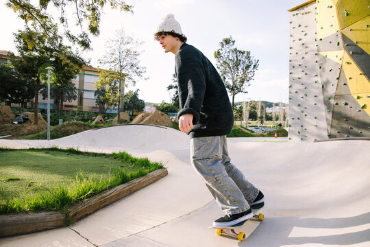 Gen Z skateboarder ride at an urban skate park