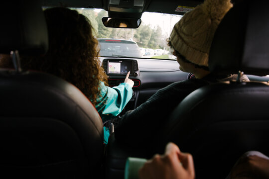 Gen Z friends use car navigation during road trip