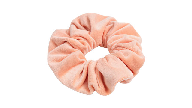 Soft pink fabric scrunchie hair band hair accessory isolated on a white background