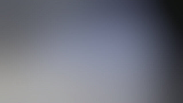 Abstract blurred grey gradient background with dark blue shade transition for corporate presentation backdrop and copy space