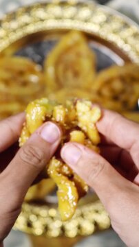 Griwech crunchy pastries , an Algerian dessert made with dough, fried and then coated with syrup and sesame seeds
