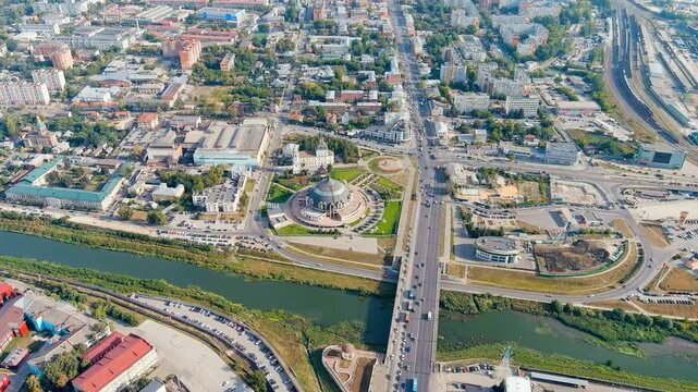 Tula, Russia. Zarechensky Bridge spanning the Upa River, Drone footage with the Museum of Weapons rotunda, summer traffic, and panoramic cityscape under clear skies. Drone footage