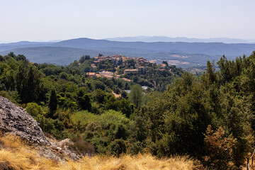 Fototapeta premium August, 14, 2026. View of Monterotondo Marittimo surrounded by the Tuscan countryside, photographed from the geothermal landscape of Le Biancane in southern Tuscany, Italy.