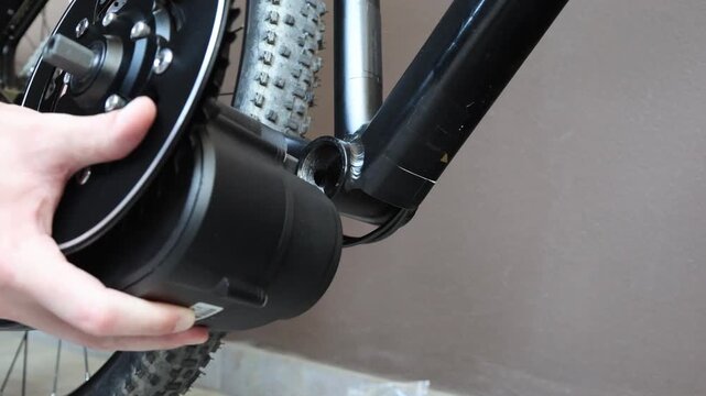 Installing electric motor on bicycle frame