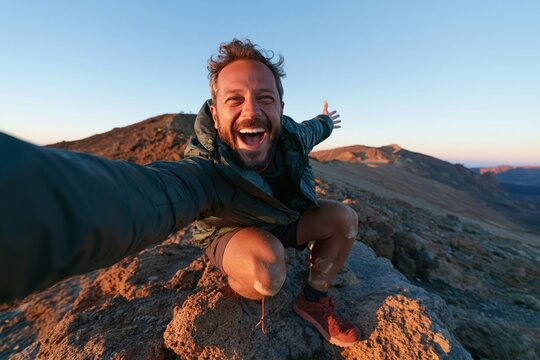 Hiker posing triumphantly with a smartphone on a porous volcanic boulder, featuring rugged textures and atmospheric haze for outdoor gear and active travel