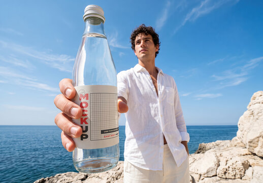 Man Holding  Sparkling Water Bottle Label Mockup