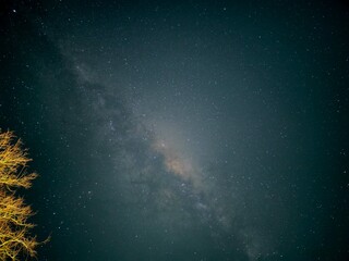 Starry night sky with bright stars and a distant galaxy in the cosmos © William
