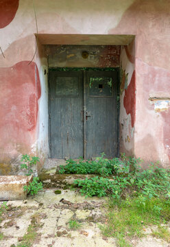 Entrance door of an old abandoned military building from the communist era in Czechoslovakia during the Cold War