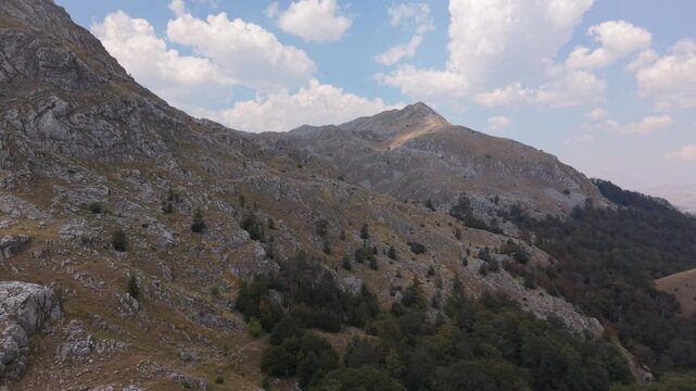 Drone Aerial View Flying Along Steep Rocky Mountain Slopes Towards Peak on Visocica