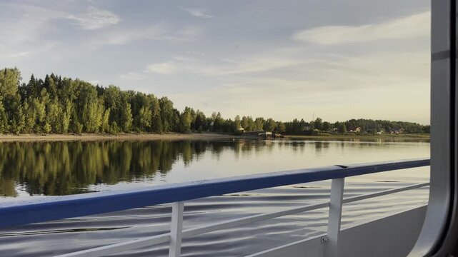 View from the window of a cruise ship over the Volga-Don Canal and a narrow strip of the river.