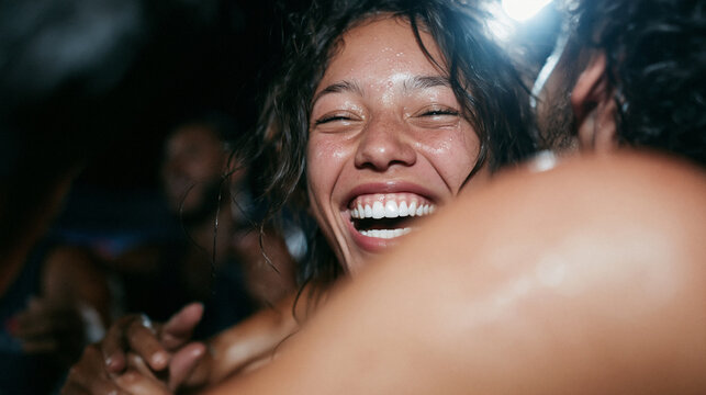 Ecstatic Young Woman Laughing and Dancing at Night Party