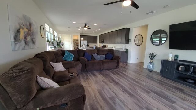 Modern living room with open kitchen and glass doors