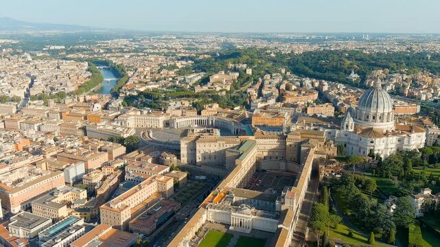 Rome, Italy. St. Peter's Basilica and Piazza San Pietro, the iconic Renaissance dome and Bernini's sweeping colonnade, Drone footage over the Vatican at evening light. Drone footage