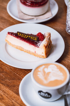 Collection of delicious food, breakfast dishes, pastries, cakes, coffee, colorful drinks and desserts served in cozy caf&eacute; and restaurant settings, photographed in warm natural light.