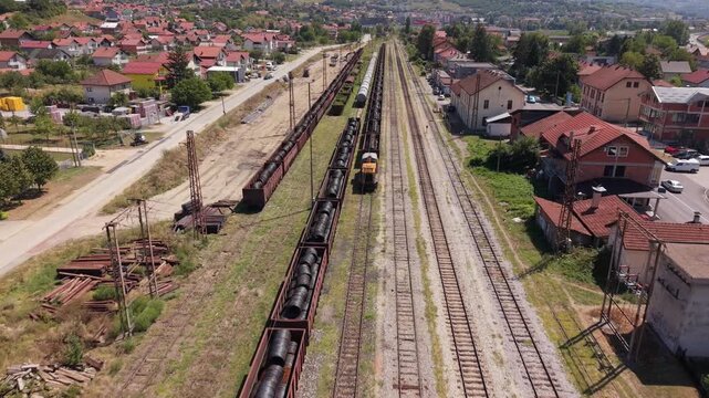 Drone Aerial View Flying Over Railway Tracks and Freight Train Wagons at Podlugovi Train Station