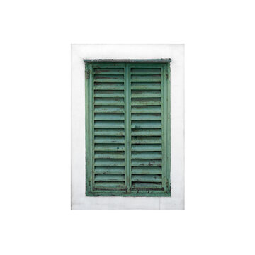 Close-up view of a rustic green shuttered window set isolated on white background
