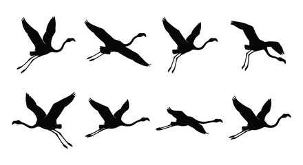 Naklejka premium Black silhouettes of flying cranes depict a dynamic vector illustration