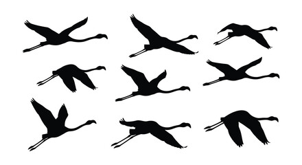 Naklejka premium Black silhouettes of flying cranes depict a dynamic vector illustration