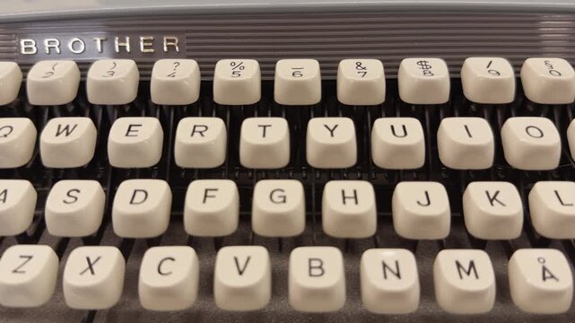 Helsinki, Finland - August 08, 2026: Close-up view of a Brother typewriter keyboard, highlighting the keys and brand logo, showcasing the vintage design and layout of the QWERTY keyboard configuration