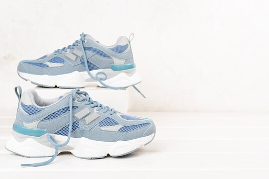 Pair of sneakers on wooden background