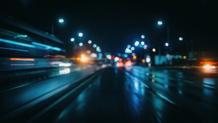 Obraz premium Abstract motion blur of city traffic lights on a rainy night highway. Perfect for high-speed travel, urban transportation, and modern technology conceptual backgrounds.