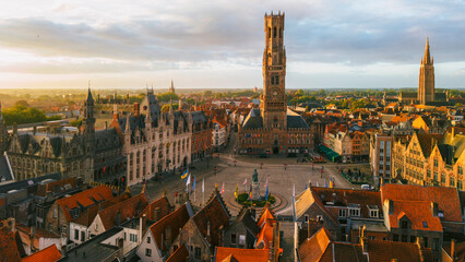 Naklejka premium Aerial view of Bruges old town and market square during sunrise Belgium