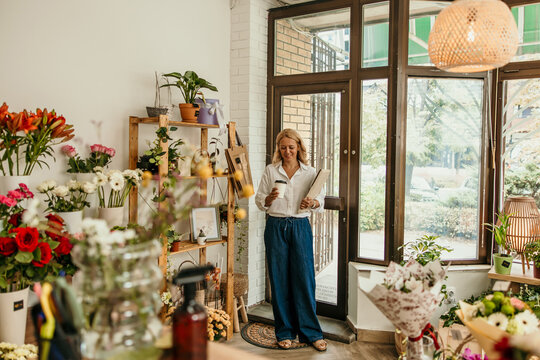 Woman entrepreneur managing her small business flower shop