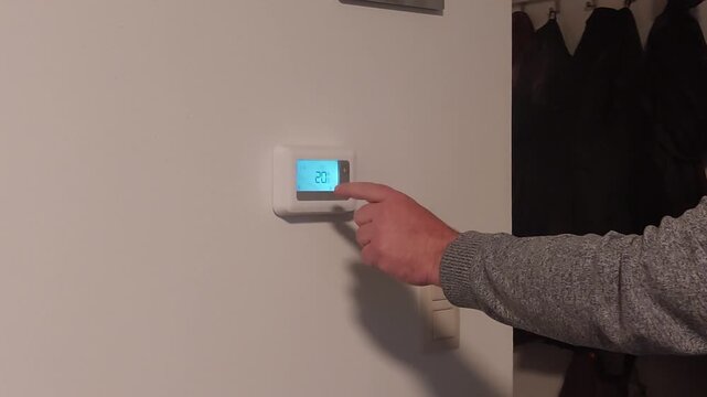 Regulating temperature with a digital thermostat in a living room