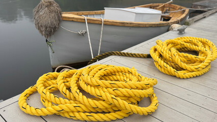 Bright Yellow Coils of Rope and Dockside Dinghy  © John Alphonse