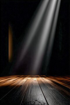 Light breaks through darkness on a wooden stage