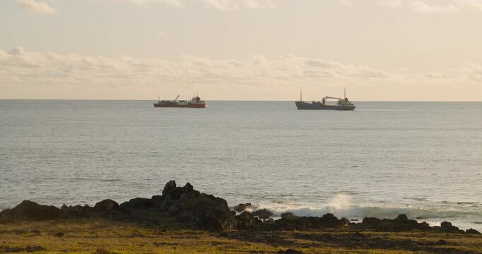 Fishing boats in the coast of Ahu Tahai, Hanga Roa, Easter Island during sunset