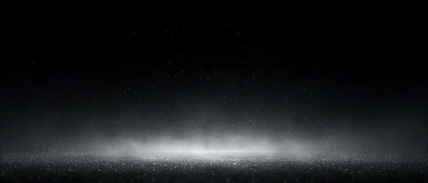 Illuminated snow dust and ground fog on black background. Highlighting sparkling glitter or snow dust floating. Sparkling winter mist and spotlight overlay. Сhristmas background