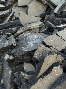 Cracked dry earth texture with scattered pieces, suitable for natural background or environmental theme
