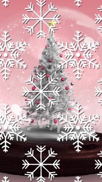 Animation of christmas ball over snow falling