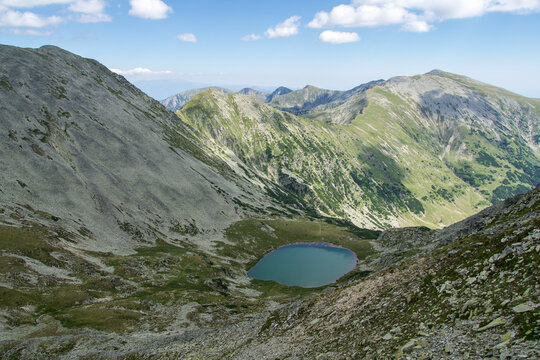 mountain landscape with blue sky, Peleaga Lake, Retezat Mountains, Romania 