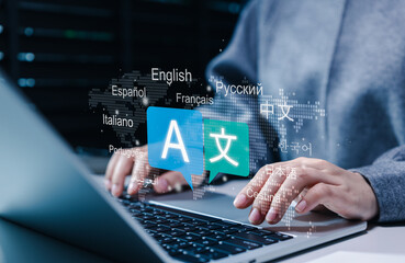 Multilingual language translation technology concept. Person using laptop with icons languages, global language translate, multilingual communication, and international connections. AI translator © Sandwish