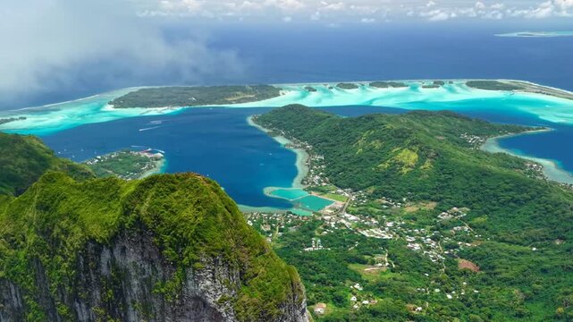 Video of French Polynesia tropical paradise 
island Bora Bora in Pacific Ocean. Beautiful clip with
sandy beach, palm trees, coral reef, azure ocean, sky 
with clouds on horizon. Drone aerial view.