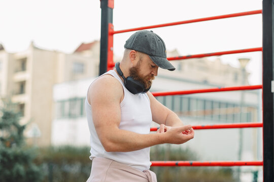 Concentrated man counting the beats of his pulse