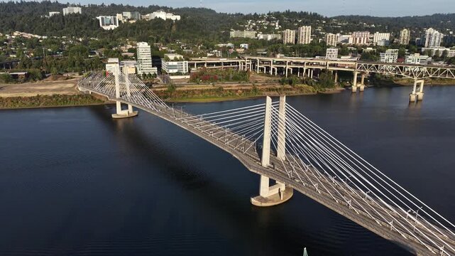Aerial view of Tilikum Crossing, Portland&rsquo;s Bridge of the People, spanning the Willamette River and connecting the city with light rail, buses, cyclists, pedestrians, and scenic Pacific Northwest vie